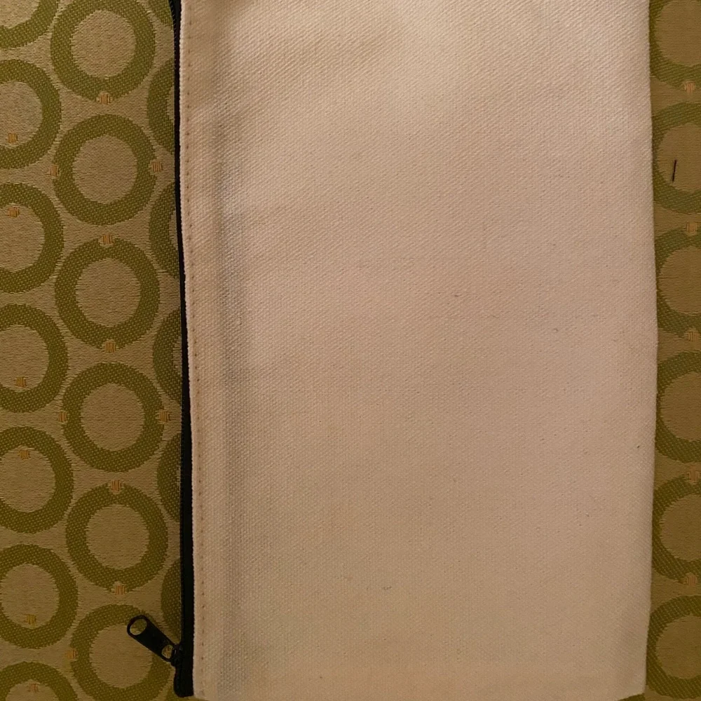 Cream and black canvas cosmetics pouch